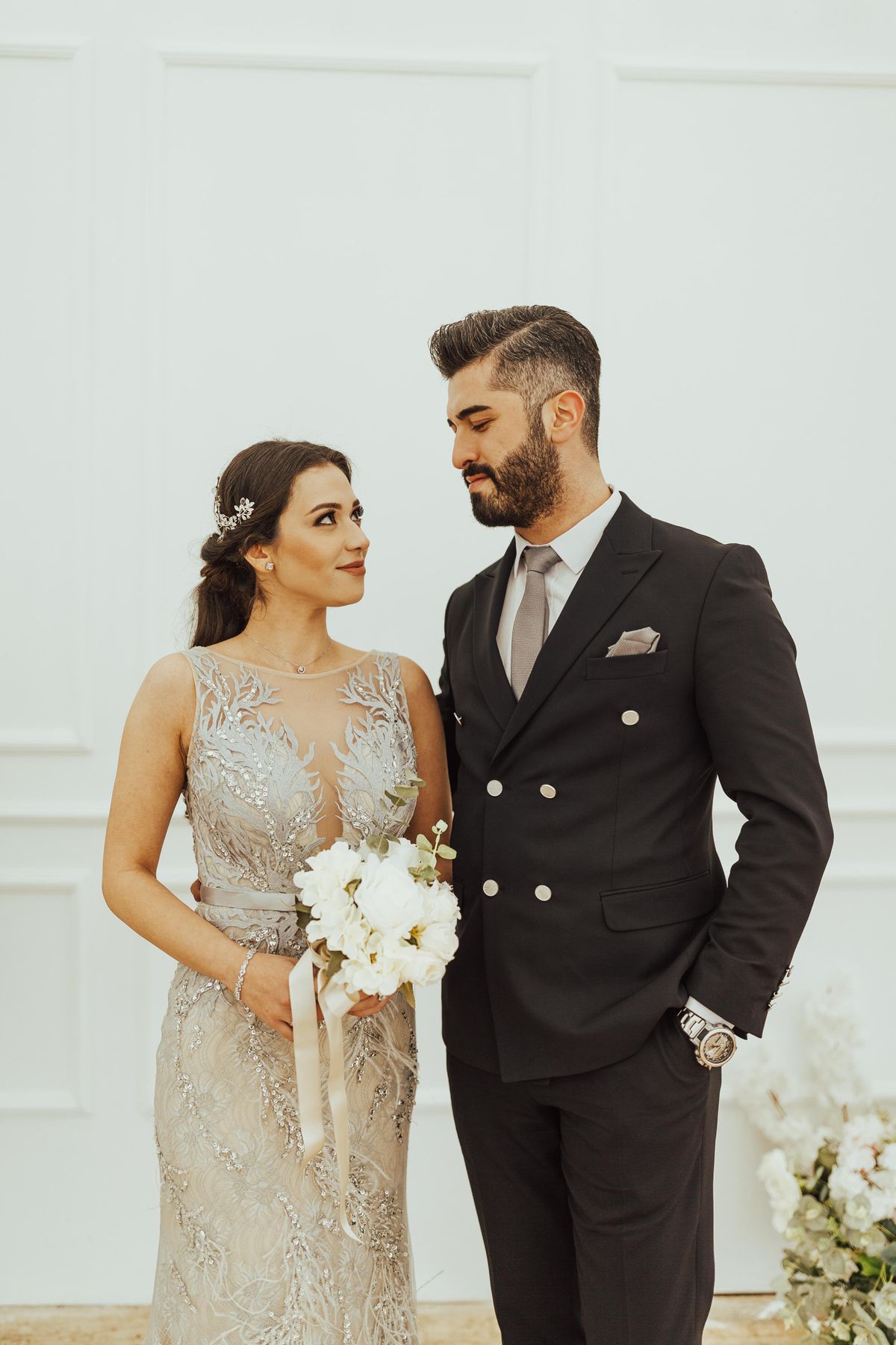 Bride and groom standing close together