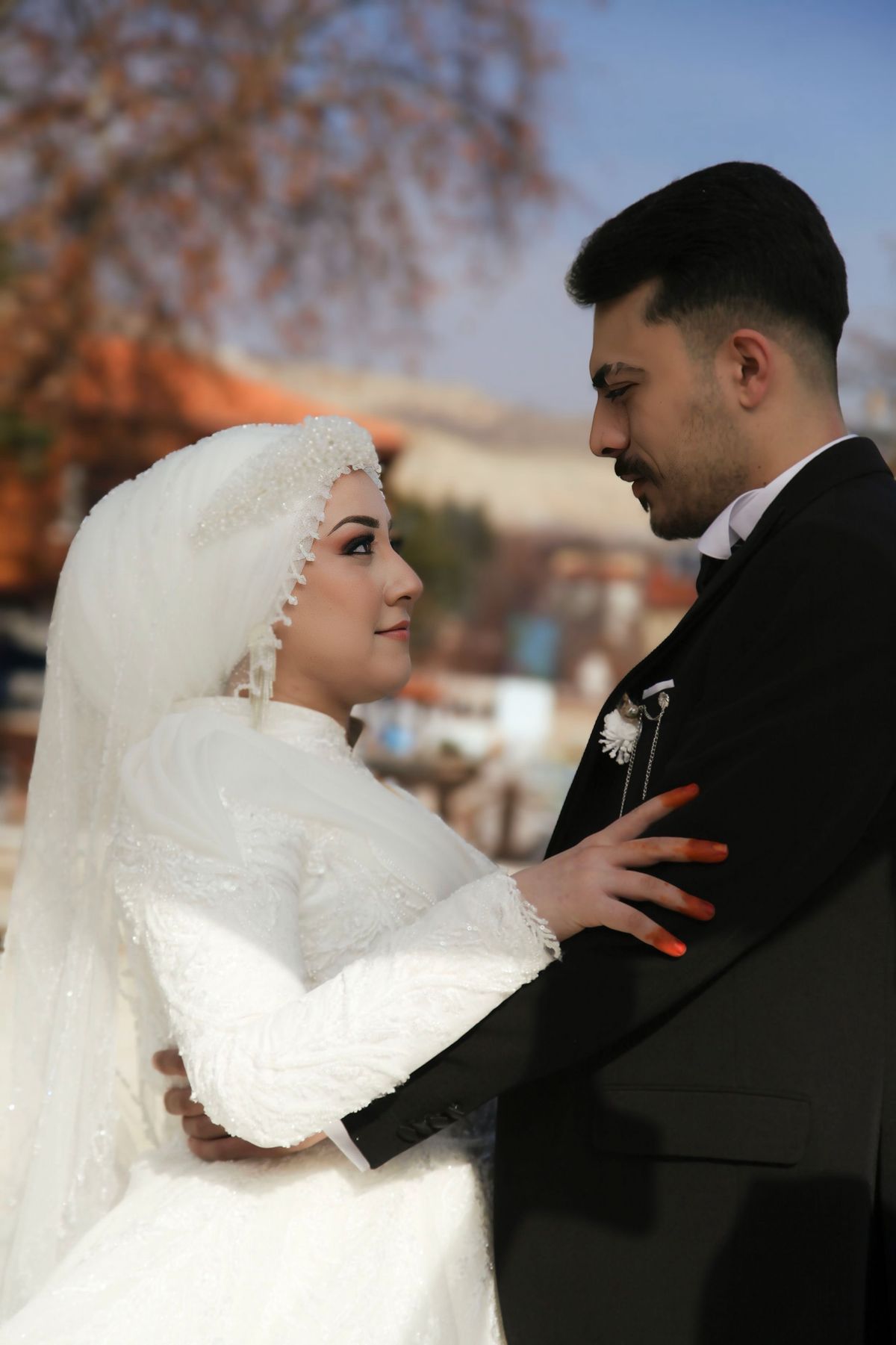 Newlyweds embracing outdoors