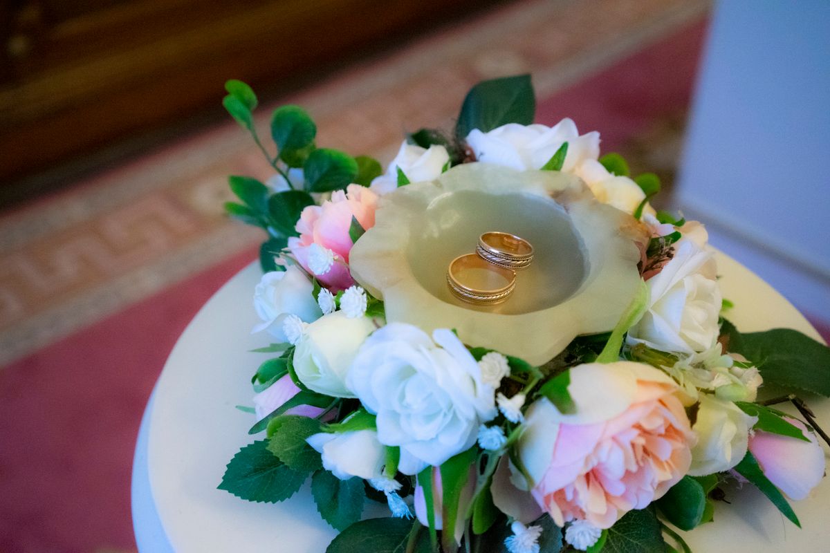 Wedding rings displayed with flowers